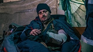 In this photo provided by Azov Special Forces Regiment of the Ukrainian National Guard Press Office, an injured Ukrainian soldier poses for a photo in Azovstal steel plant.