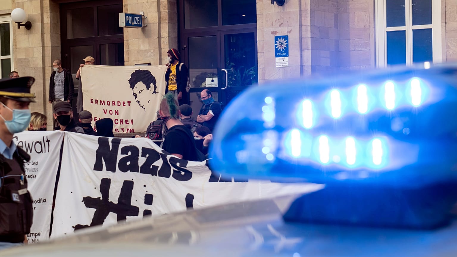 People attend an anti-racism demonstration in Dessau, Germany.