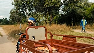 Danai heads to market on her solar-powered tricycle