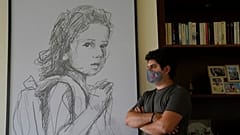 Paul Naggear, stands next a portrait of his daughter Alexandra, who was killed in 2020 massive blast at Beirut's seaport