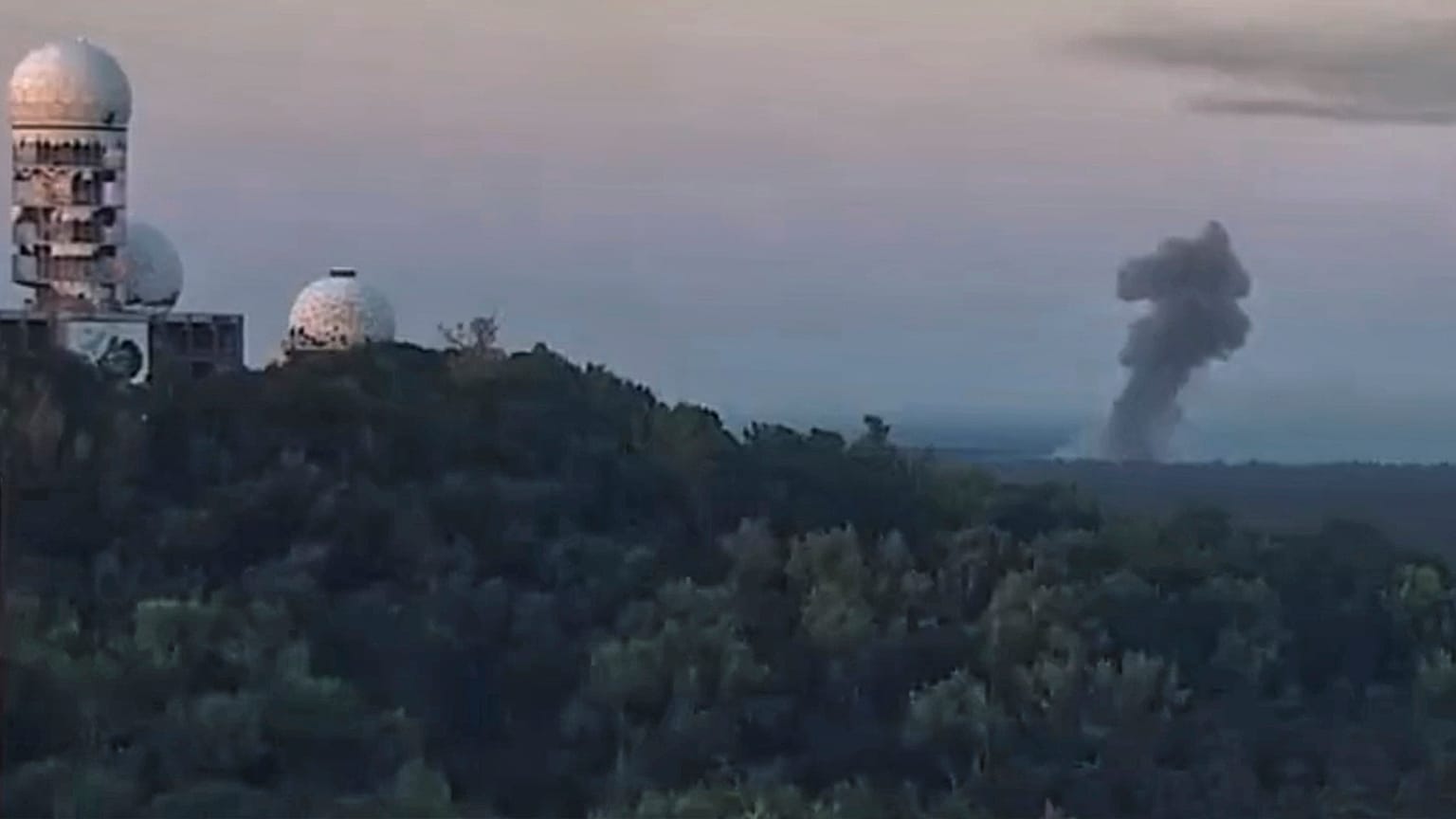 A billow of smoke is seen after an explosion at a blasting site inside the Grunewald forest in Berlin, 4 August 2022
