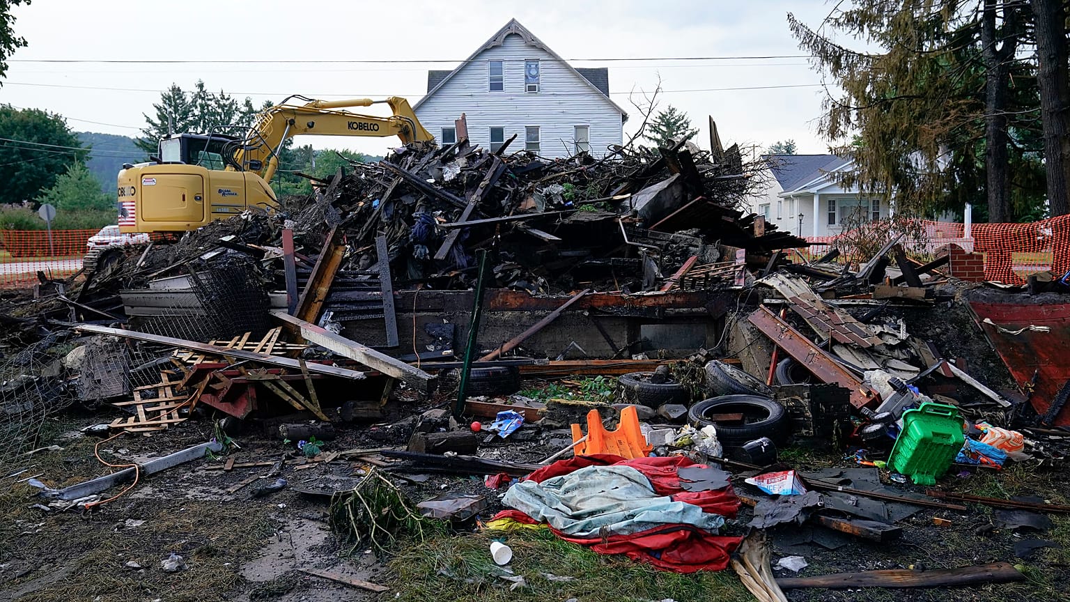 A house that was destroyed by a fatal fire is viewed in Nescopeck, Pa., Friday, Aug. 5, 2022. 