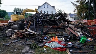 A house that was destroyed by a fatal fire is viewed in Nescopeck, Pa., Friday, Aug. 5, 2022.