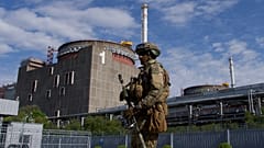 A Russian serviceman patrols the territory of the Zaporizhzhia Nuclear Power Station in Energodar on May 1, 2022.