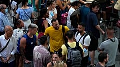 Train passengers wait at Atocha train station in Madrid, Spain, Monday, Aug. 8, 2022.