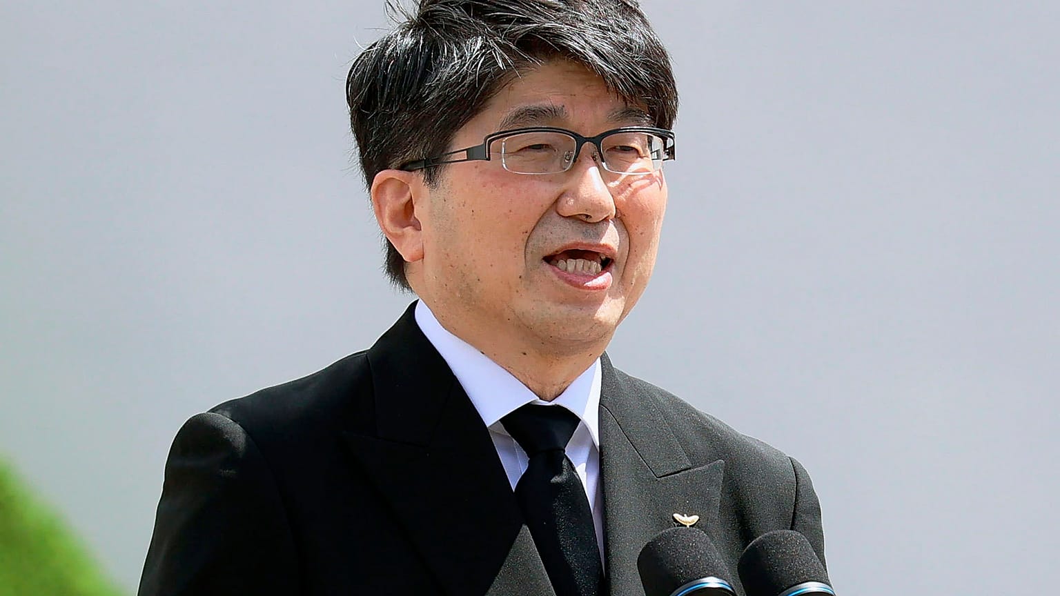 Nagasaki Mayor Tomihisa Taue delivers a speech during a ceremony at Nagasaki Peace Park in Nagasaki, southern Japan Monday, Aug. 9, 2021