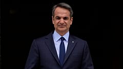FILE - Greece's Prime Minister Kyriakos Mitsotakis stands outside Maximos Mansion in Athens, May 6, 2022. 