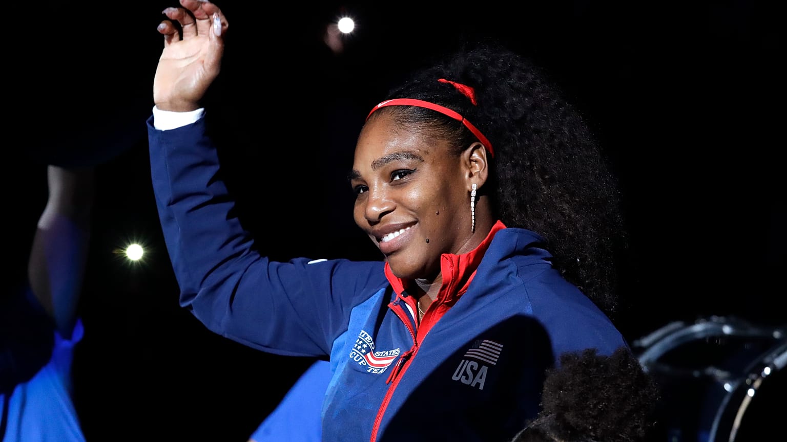 Serena Williams waves before a Fed Cup qualifying tennis match in February 2020.