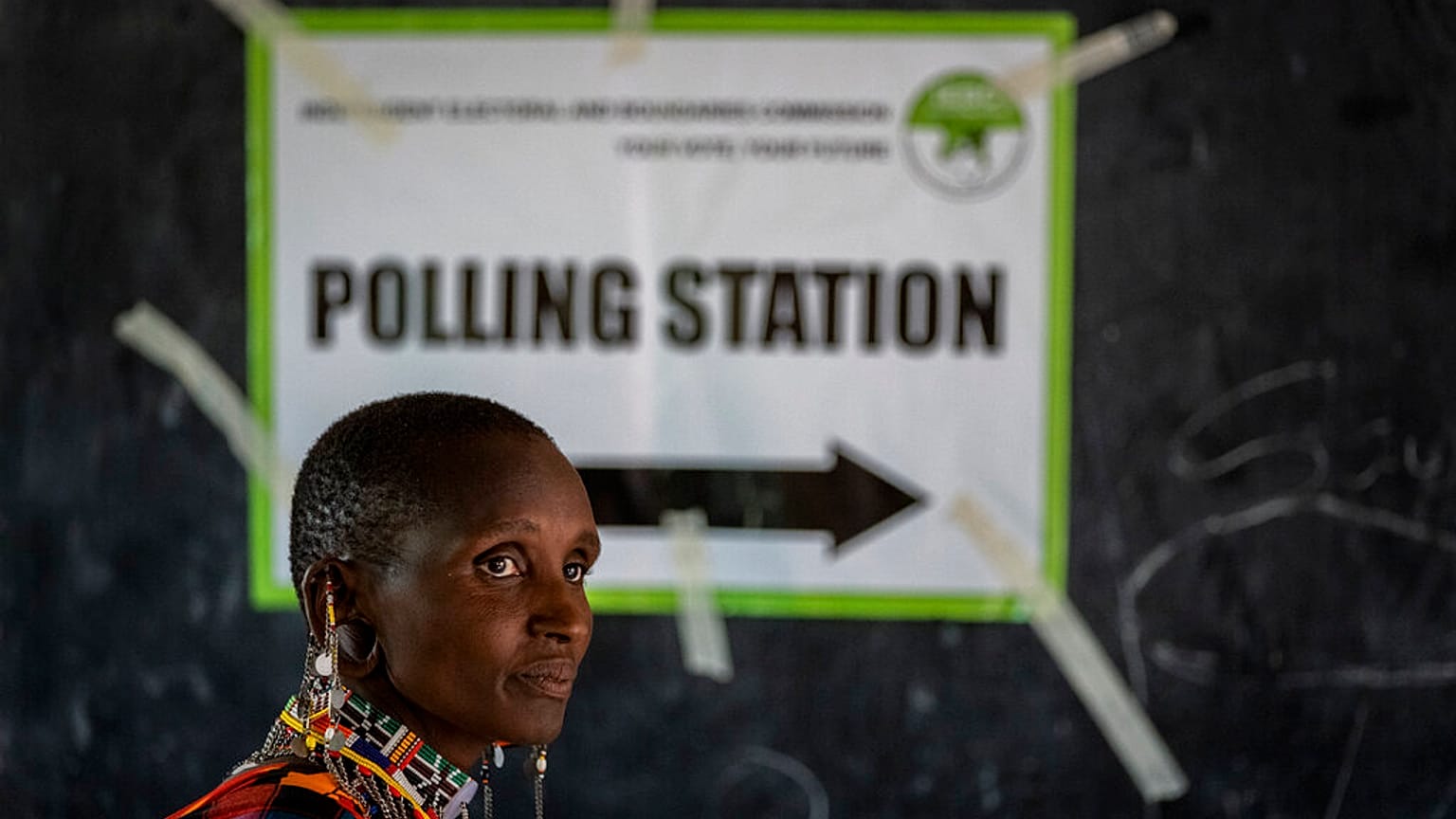 A Maasai woman waits to cast her vote at a polling station in Esonorua Primary School, in Kajiado County, Kenya Tuesday, Aug. 9, 2022.