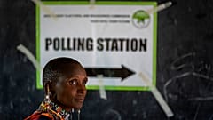 A Maasai woman waits to cast her vote at a polling station in Esonorua Primary School, in Kajiado County, Kenya Tuesday, Aug. 9, 2022.