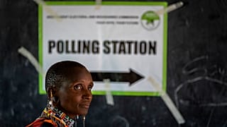 A Maasai woman waits to cast her vote at a polling station in Esonorua Primary School, in Kajiado County, Kenya Tuesday, Aug. 9, 2022.