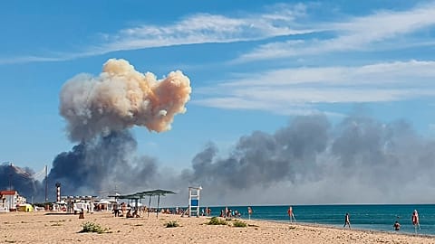 Smoke rises after explosions were heard from the direction of a Russian military airbase near Novofedorivka, Crimea August 9, 2022.