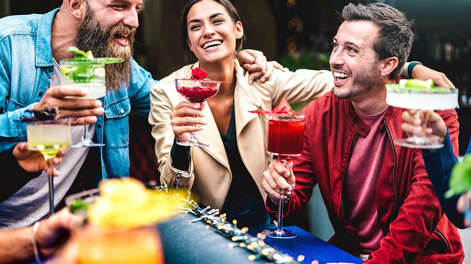 A group of friends enjoy a cocktail