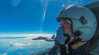 A Chinese PLA air force pilot ooks as they conduct a joint combat training exercises around the Taiwan Island on 7 August 2022