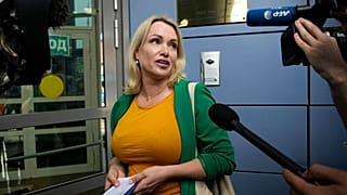 Marina Ovsyannikova arrives for a court hearing in Moscow on July 28.