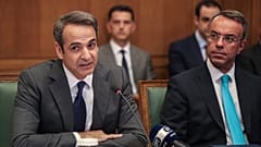 Greek Prime Ministers Kyriakos Mitsotakis, left, and Finance Minister Christos Staikouras in Athens, July 10, 2019. 