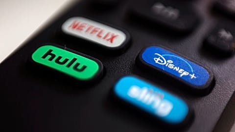 FILE - The logos for streaming services Netflix, Hulu, Disney Plus and Sling TV are pictured on a remote control on Aug. 13, 2020, in Portland, Ore. 