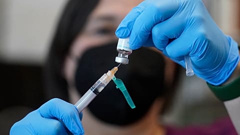 A nurse prepares a dose of a Monkeypox vaccine.