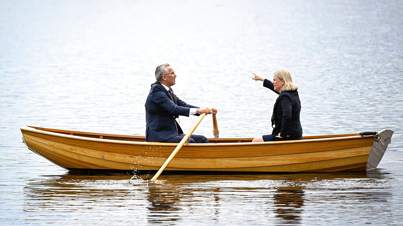 Sweden's Prime Minister Magdalena Andersson, right, and NATO Secretary General Jens Stoltenberg talk on a traditional rowboat Monday, 13 June, 2022.