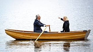 Sweden's Prime Minister Magdalena Andersson, right, and NATO Secretary General Jens Stoltenberg talk on a traditional rowboat Monday, 13 June, 2022.