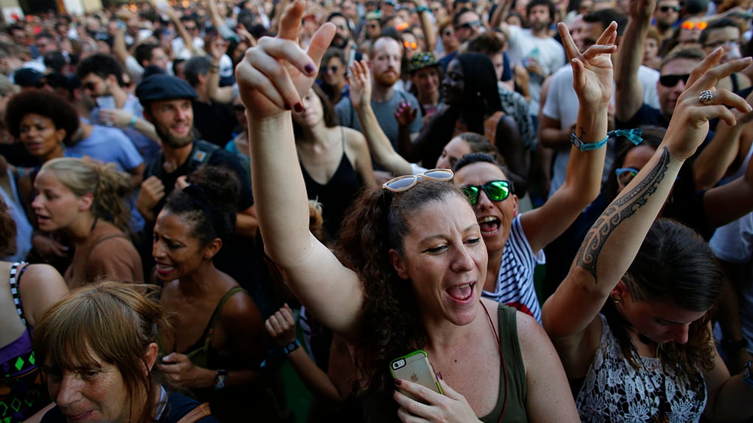 Revelers dance during the 24th Advanced Music and Multimedia Art International Sonar Festival in Barcelona, Spain, Friday, June 16, 2017.