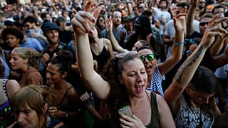 Revelers dance during the 24th Advanced Music and Multimedia Art International Sonar Festival in Barcelona, Spain, Friday, June 16, 2017.