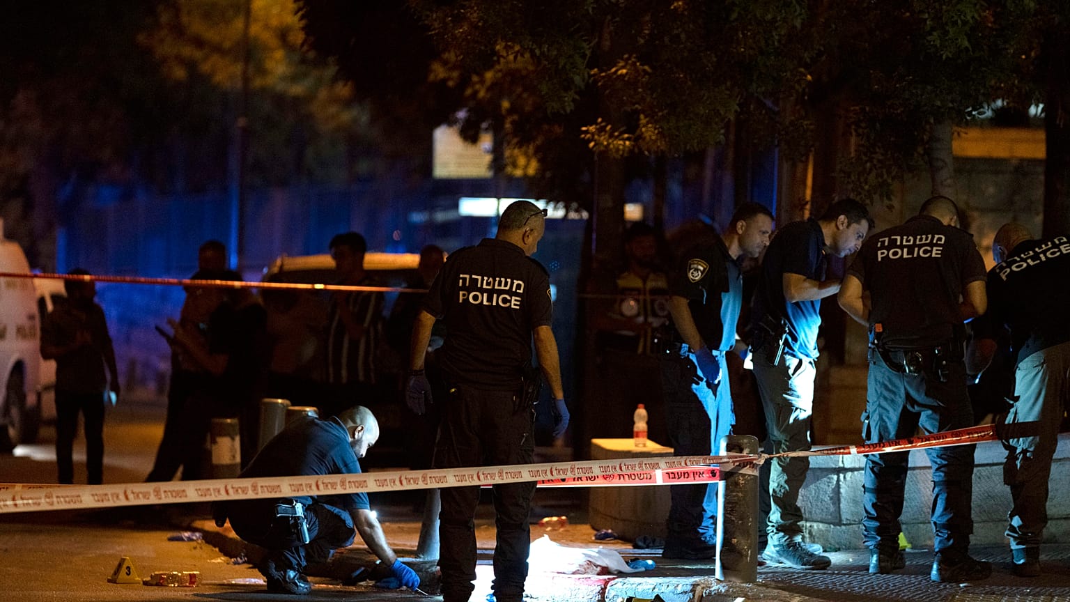 Israeli police work at the scene of the shooting near the Old City of Jerusalem, August 14, 2022.