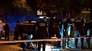 Israeli police work at the scene of the shooting near the Old City of Jerusalem, August 14, 2022.