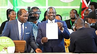 William Ruto, centre, shows a certificate after the announcement of the results of the presidential race at the Centre in Bomas, Nairobi, Kenya, Monday, Aug. 15, 2022.