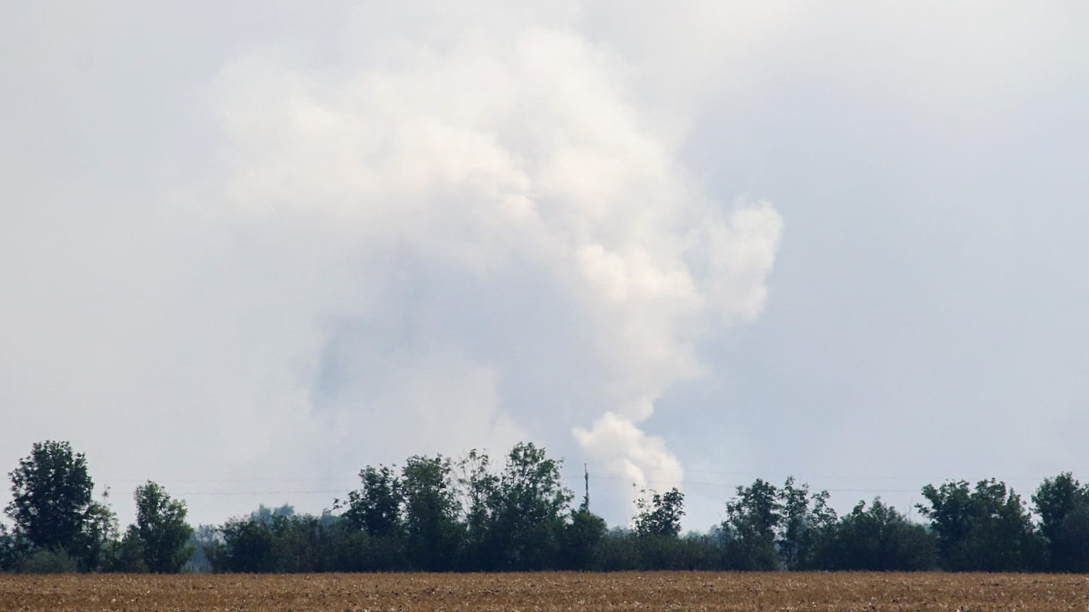 A view shows smoke rising above the area following an alleged explosion in the village of Mayskoye in the Dzhankoi district, Crimea, August 16, 2022.