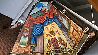 The mural painted in 1910 by a Lithuanian immigrant has been rehabilitated and moved and is what experts say is a rare piece of art.