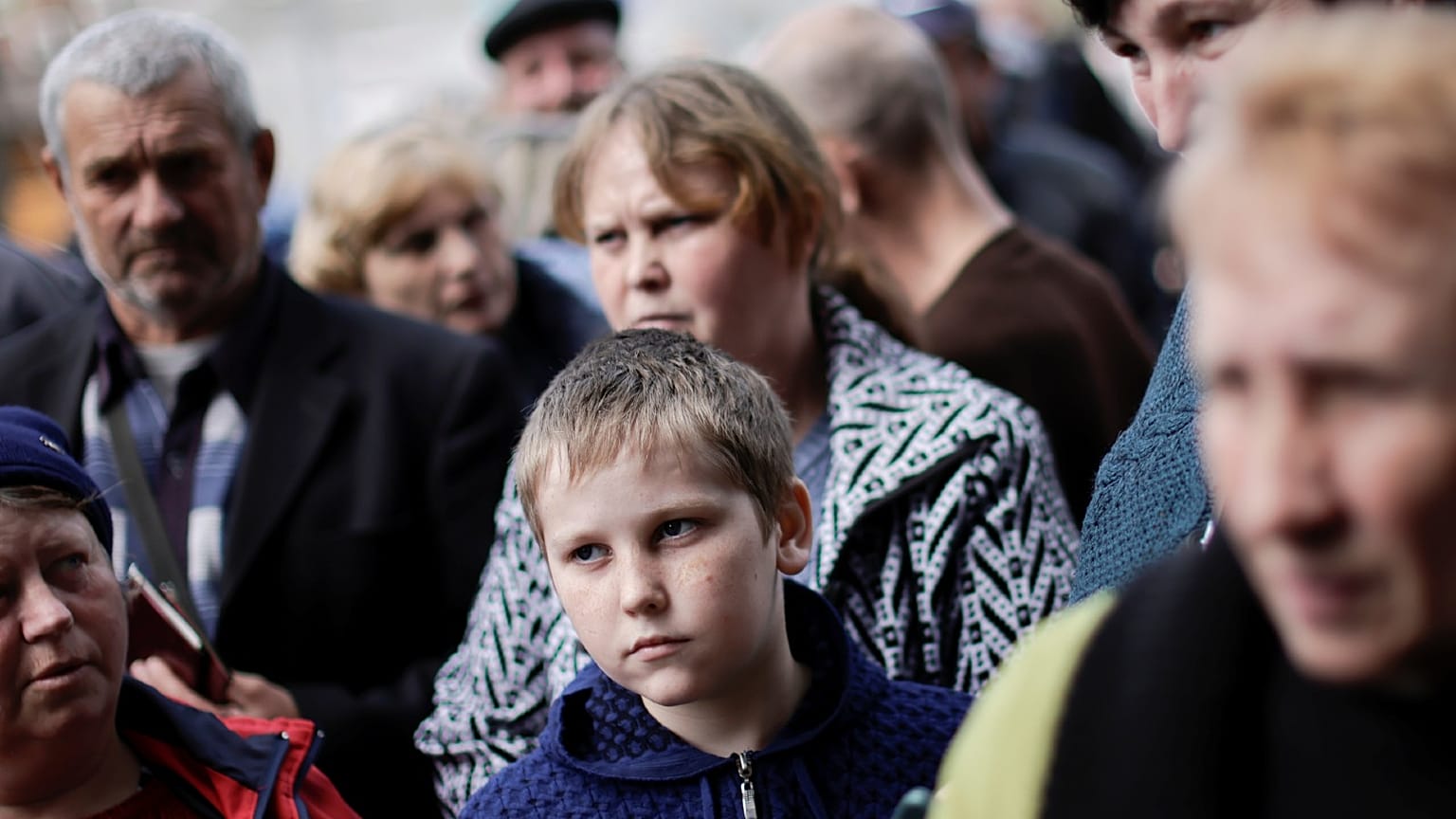 Ukrainian refugees wait to collect aid and register at a centre for internally displaced people, amid Russia's invasion of Ukraine, in the town of Kryvyi Rih
