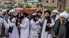 Mourners carry the body of a victim of a mosque bombing in Kabul, Afghanistan, Thursday, Aug. 18. 2022.