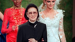 Japanese fashion designer Hanae Mori, center, is applauded by models after the presentation of her 1997-98 fall-winter haute couture collection