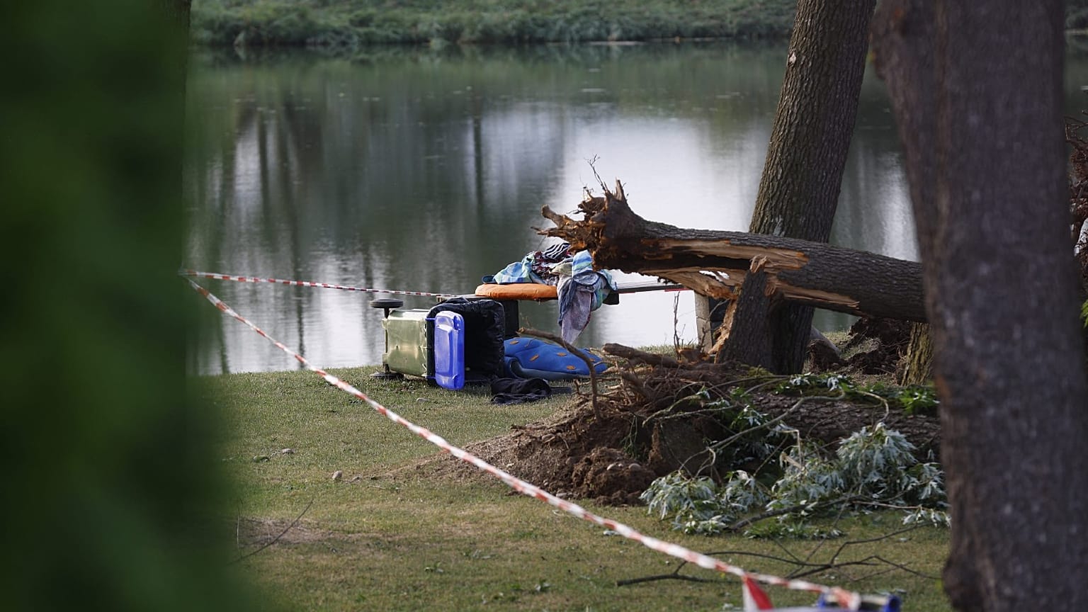 Branches and fallen trees are seen near Lake St. Andraer after a severe storm hit in Lavanttal, southern Austria, on August 18, 2022, killing two children.