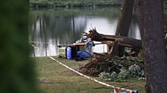 Branches and fallen trees are seen near Lake St. Andraer after a severe storm hit in Lavanttal, southern Austria, on August 18, 2022, killing two children.
