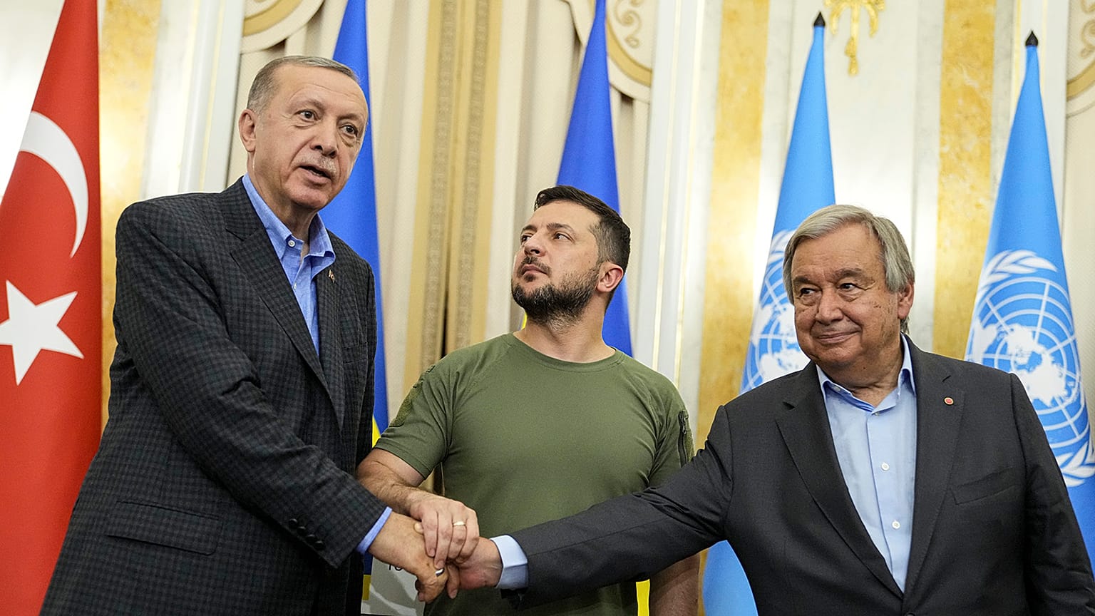 Ukraine's Volodymyr Zelenskyy, Turkish President Recep Tayyip Erdogan, and UN Secretary General Antonio Guterres shake hands after their meeting in Lviv on 18 August