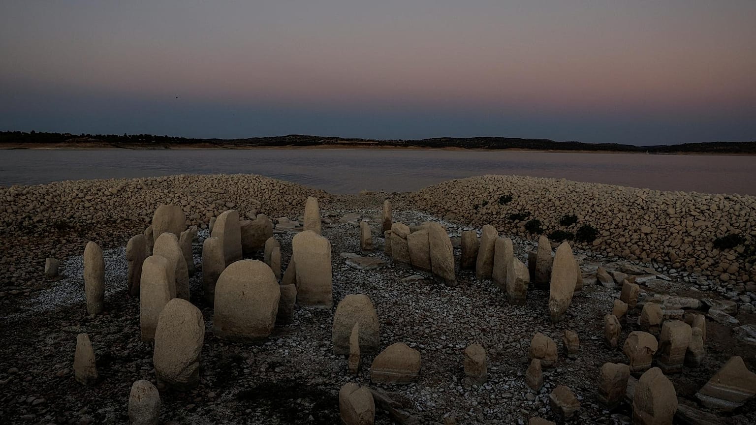 The dolmen of Guadalperal, also known as the Spanish Stonehenge, is seen due to the receding waters of the Valdecanas reservoir in the outskirts of El Gordo, Spain.