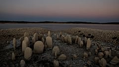 The dolmen of Guadalperal, also known as the Spanish Stonehenge, is seen due to the receding waters of the Valdecanas reservoir in the outskirts of El Gordo, Spain.