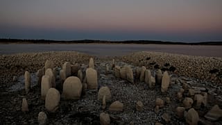 The dolmen of Guadalperal, also known as the Spanish Stonehenge, is seen due to the receding waters of the Valdecanas reservoir in the outskirts of El Gordo, Spain.