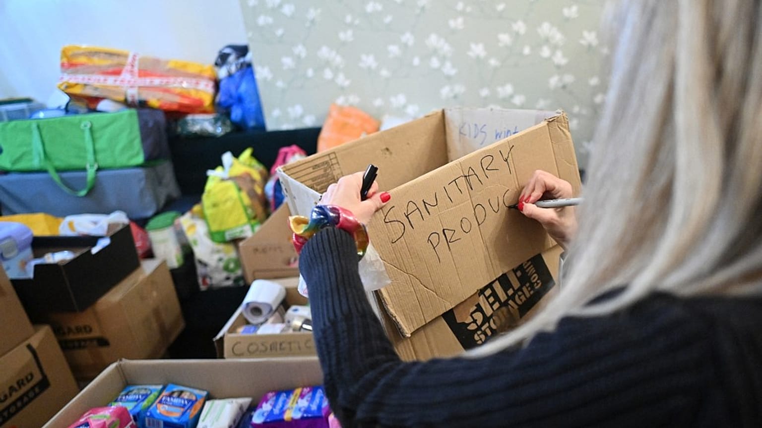 A volunteer in south London collects goods to be sent for Ukrainian refugees