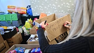 A volunteer in south London collects goods to be sent for Ukrainian refugees