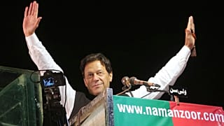 Former Pakistani Prime Minister Imran Khan waves to his supporters during an anti government rally, in Lahore, Pakistan, April 21, 2022.
