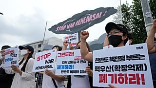 Protesters stage a rally to oppose the joint military exercises between the U.S. and South Korea in front of the presidential office in Seoul, South Korea, Aug. 22, 2022.