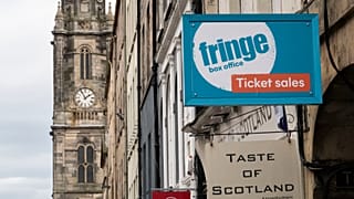 A sign for tickets on the Royal Mile