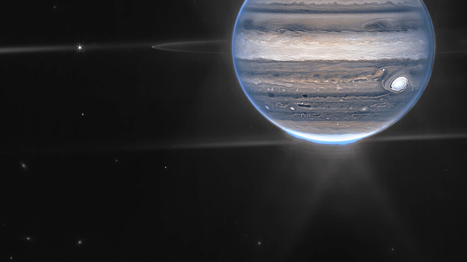 Cette image fournie par la NASA montre une image composite en fausses couleurs de Jupiter obtenue par le télescope spatial James Webb le 27 juillet 2022.