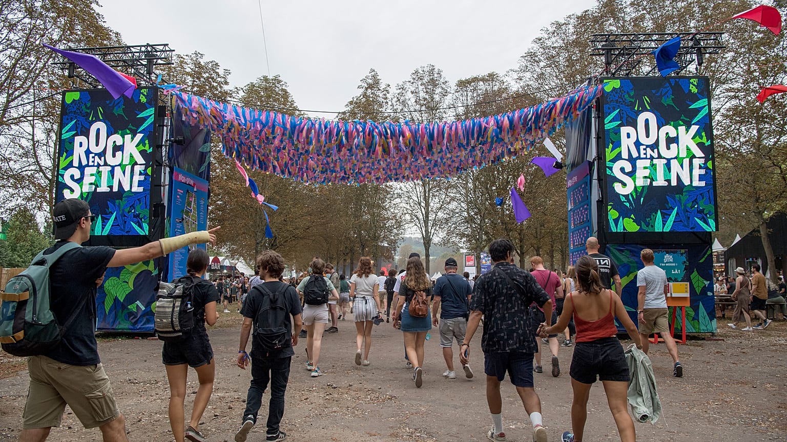 Festival-goers enter the 18th edition of the Rock en Seine music festival 