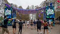 Festival-goers enter the 18th edition of the Rock en Seine music festival 