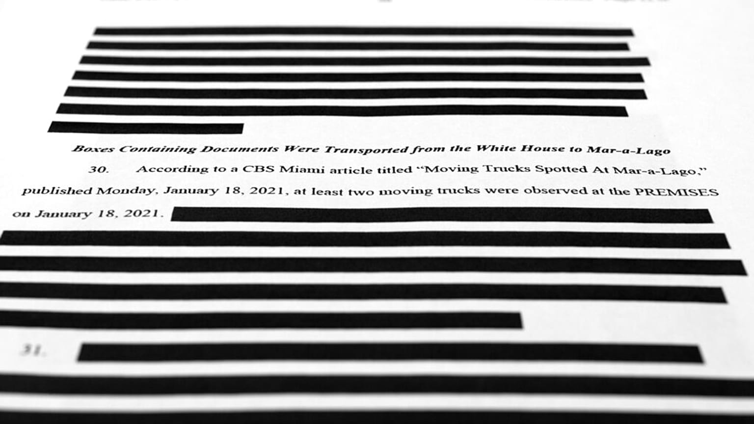 Pages from the affidavit by the FBI in support of obtaining a search warrant for former President Donald Trump's Mar-a-Lago estate are photographed Friday, Aug. 26, 2022.
