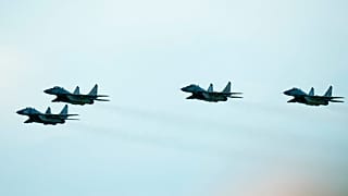 Slovak Air Force MiG-29s fly over an airport during an airshow in Malacky, Slovakia, Saturday, Aug. 27, 2022